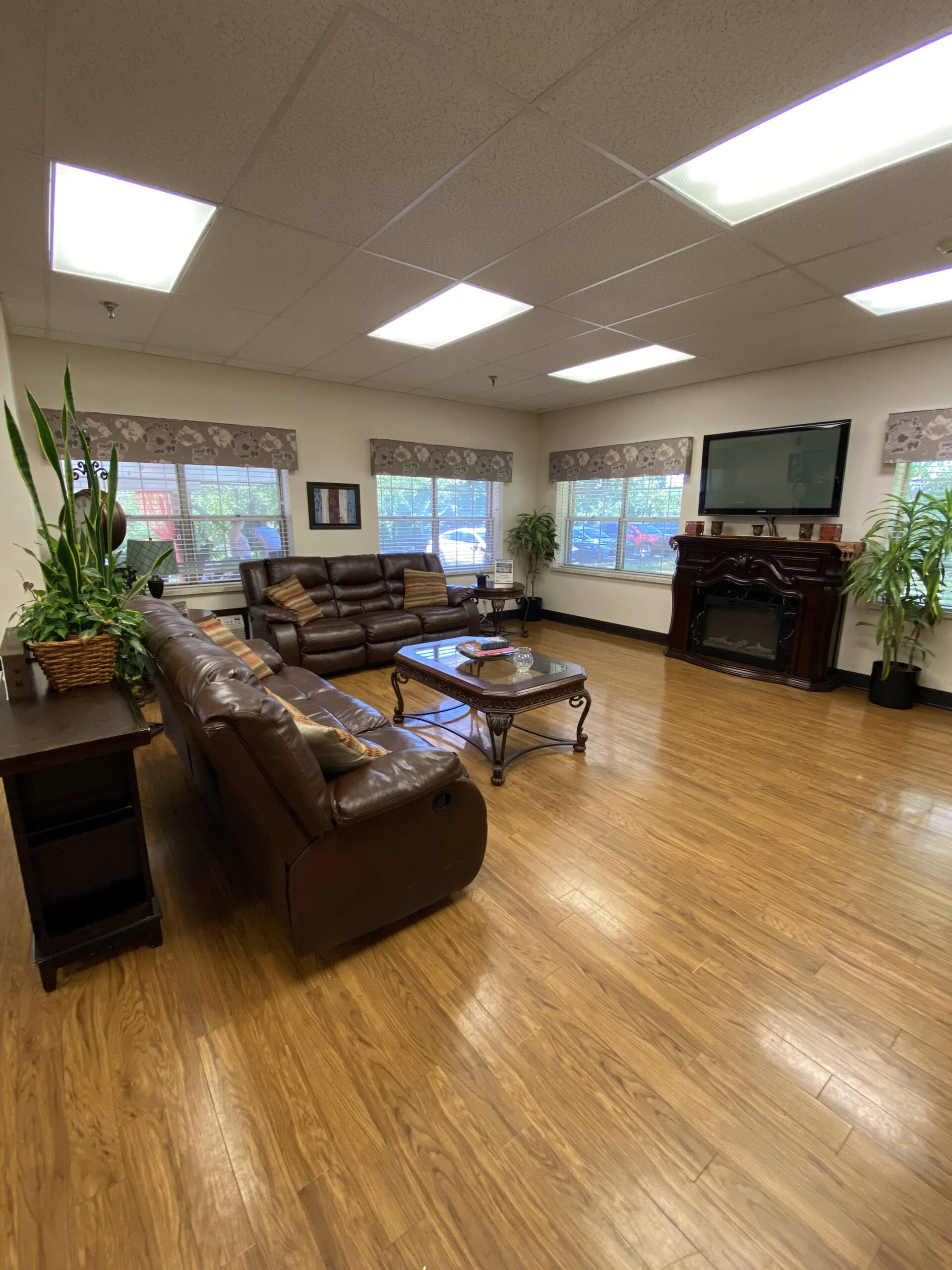 Brickyard Healthcare Bloomington Care Center sitting area with couches and TV