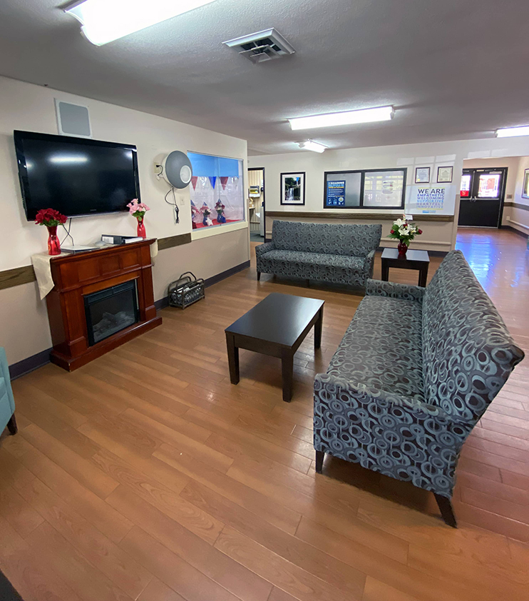 Brickyard Healthcare Brandywine Care Center sitting area with fireplace and TV