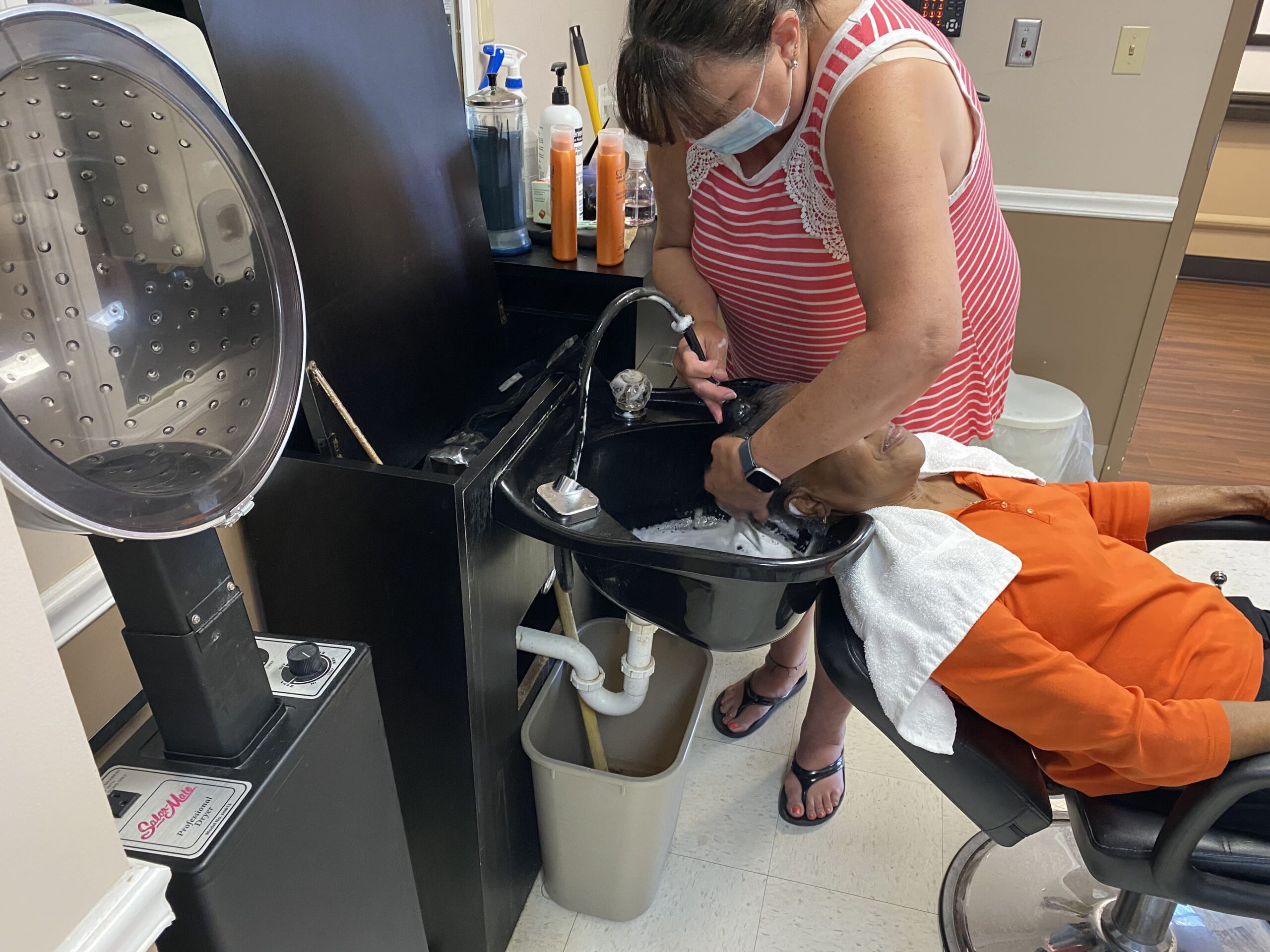 Brickyard Healthcare Fountainview Care Center resident getting hair washed at the salon