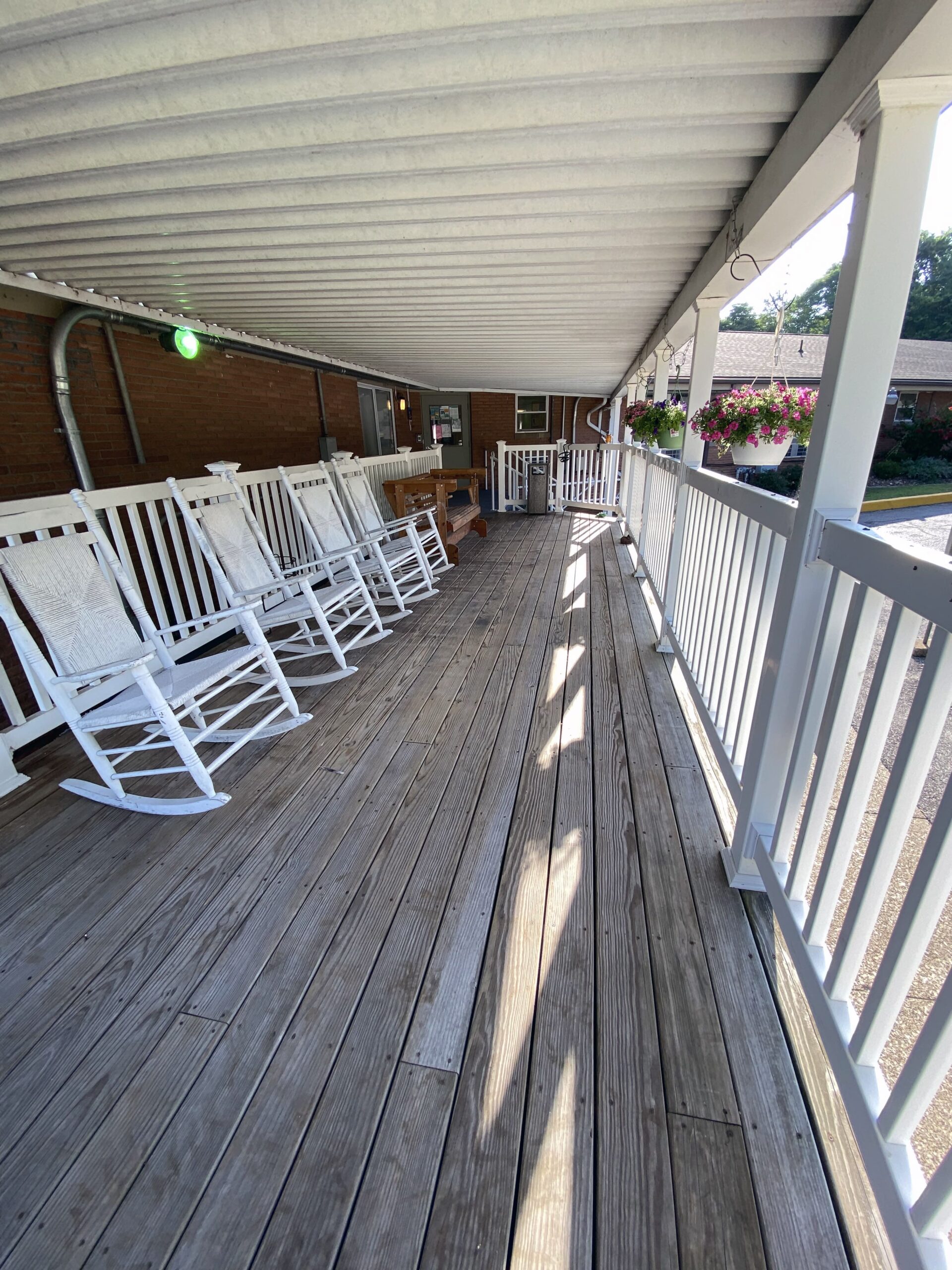Brickyard Healthcare Lincoln Hills Care Center exterior porch with rocking chairs