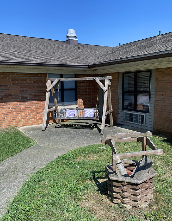 Brickyard Healthcare Petersburg Care Center exterior swing in patio area