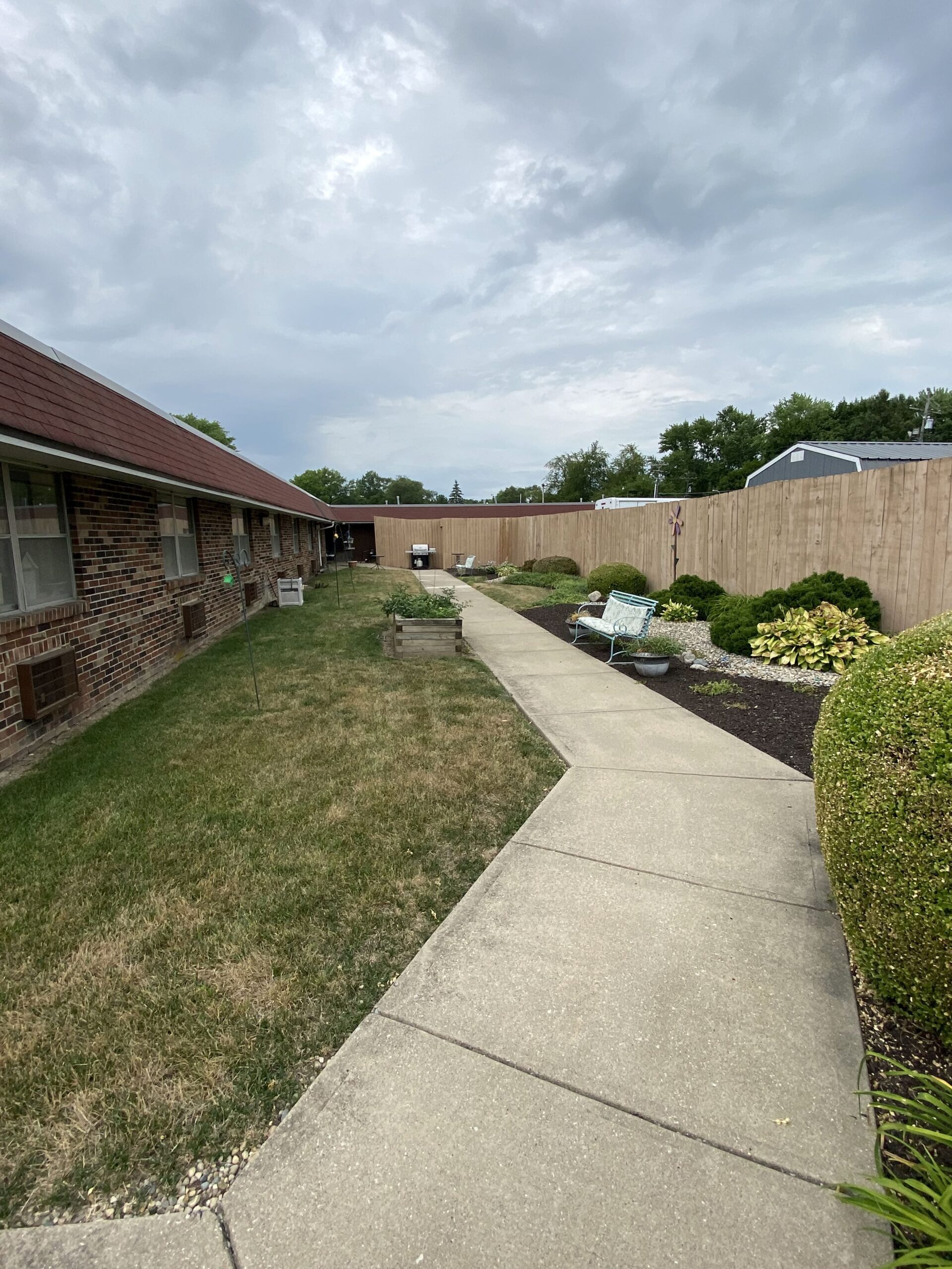 Brickyard Healthcare Sycamore Village Care Center exterior pathway for residents to walk