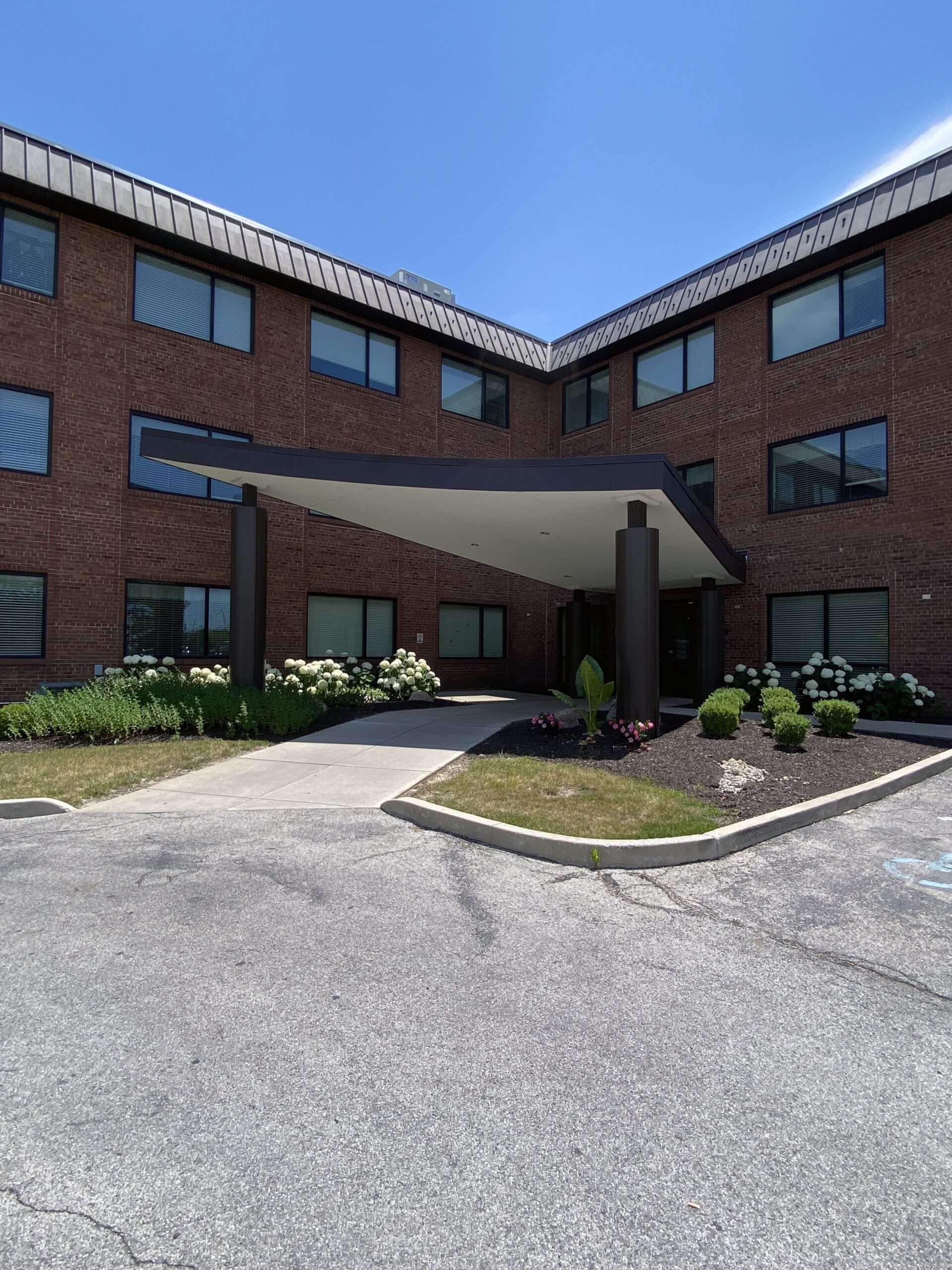 Brickyard Healthcare Willow Springs Care Center exterior front entrance from parking lot