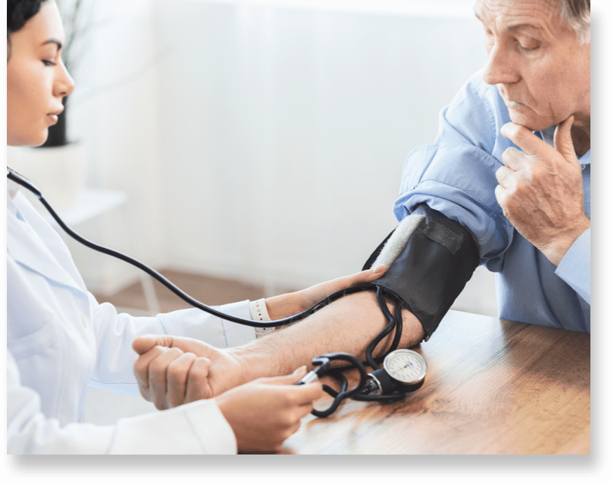 A Brickyard Healthcare nurse takes a patient's heartrate.