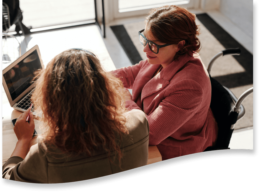 A team of caregivers discuss a comprehensive care plan.